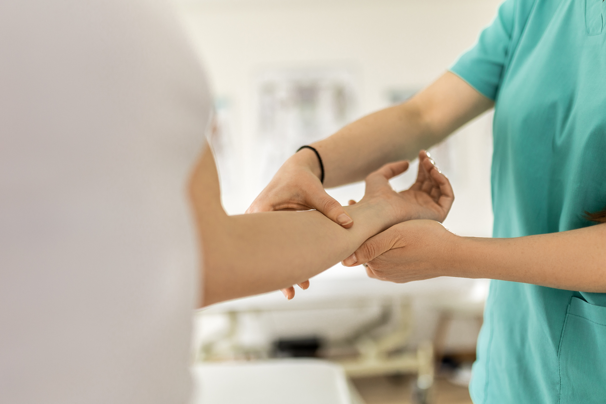 Young woman at physical therapy program for wrist carpal tunnel syndrome